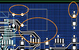 Figure 3. Note how copper pours created with PowerPCB avoid tracks, pads, and vias by maintaining clearances from other electrical objects in the area